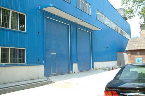 湘潭漣鋼工業(yè)提升門案例 - 中出網(wǎng)-智能出入口與停車充電門戶